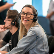 A happy looking Youi employee wearing a telephony headset.