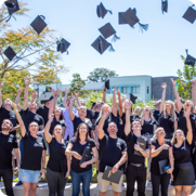 A group of Youi employees graduating from a course.