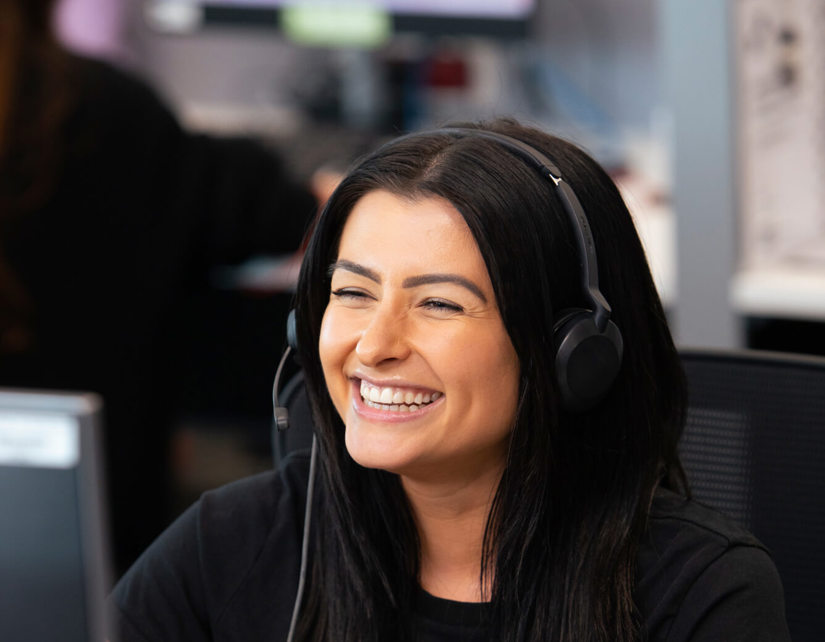 Smiling lady with headset.