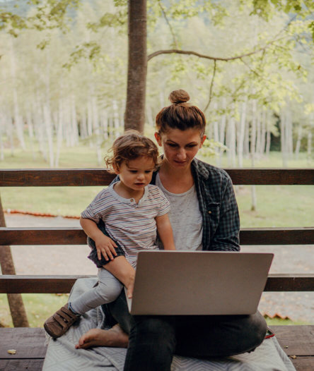 Lady with laptop and child